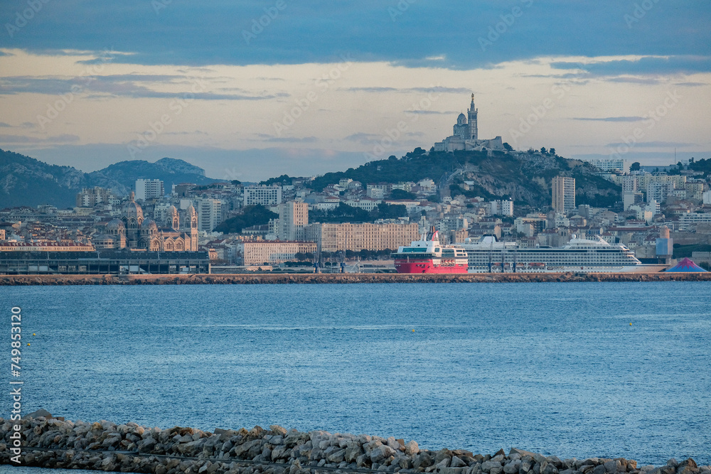 Passenger pax roro ferry cruiseship cruise ship liner in port of Marseille Provence, Cote d´Azur France with city skyline modern architecture Passenger pax roro ferry cruiseship cruise ship liner in port of Marseille Provence, Cote d´Azur France with city skyline modern architecture