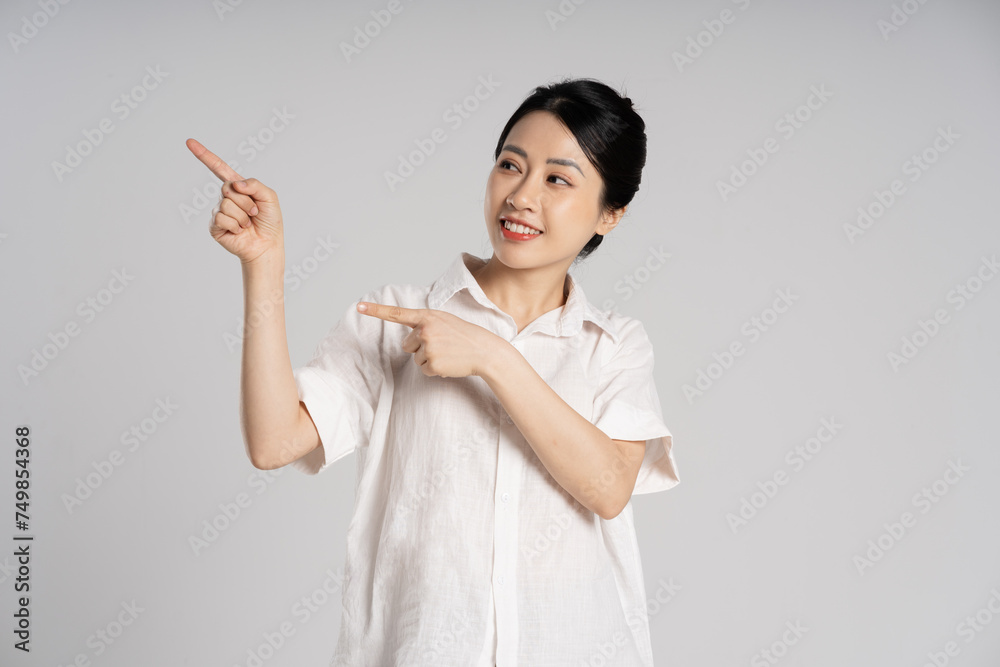 Portrait of beautiful asian woman posing on white background Portrait of beautiful asian woman posing on white background