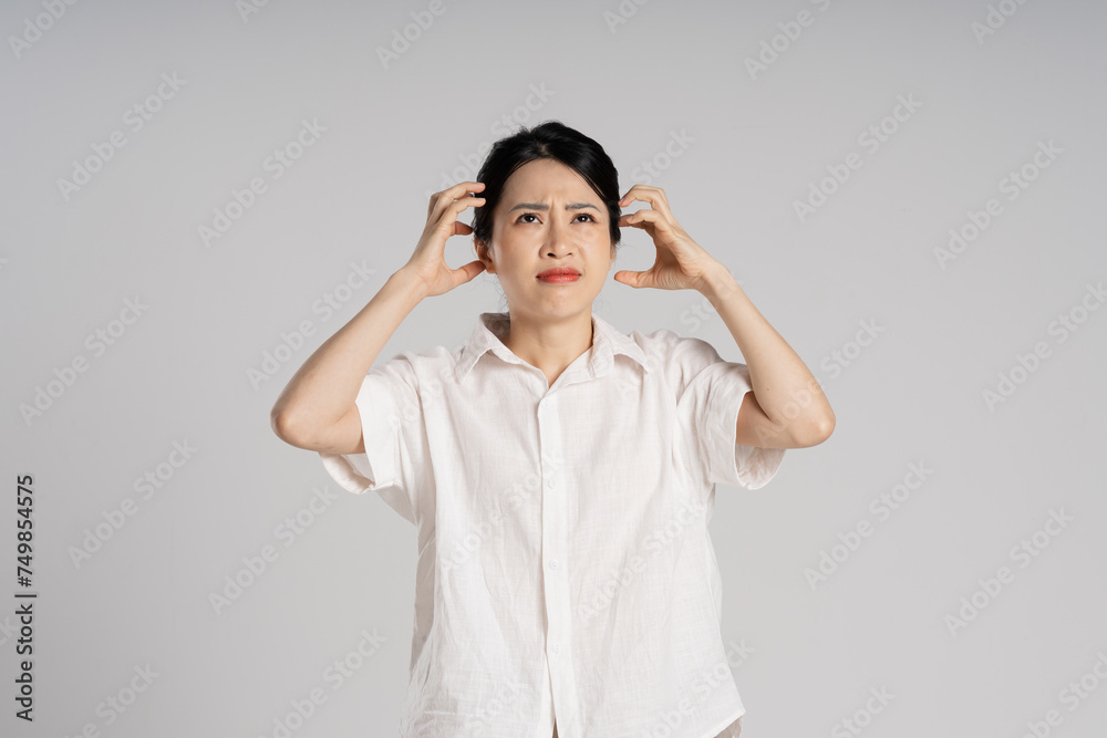 Portrait of beautiful asian woman posing on white background Portrait of beautiful asian woman posing on white background
