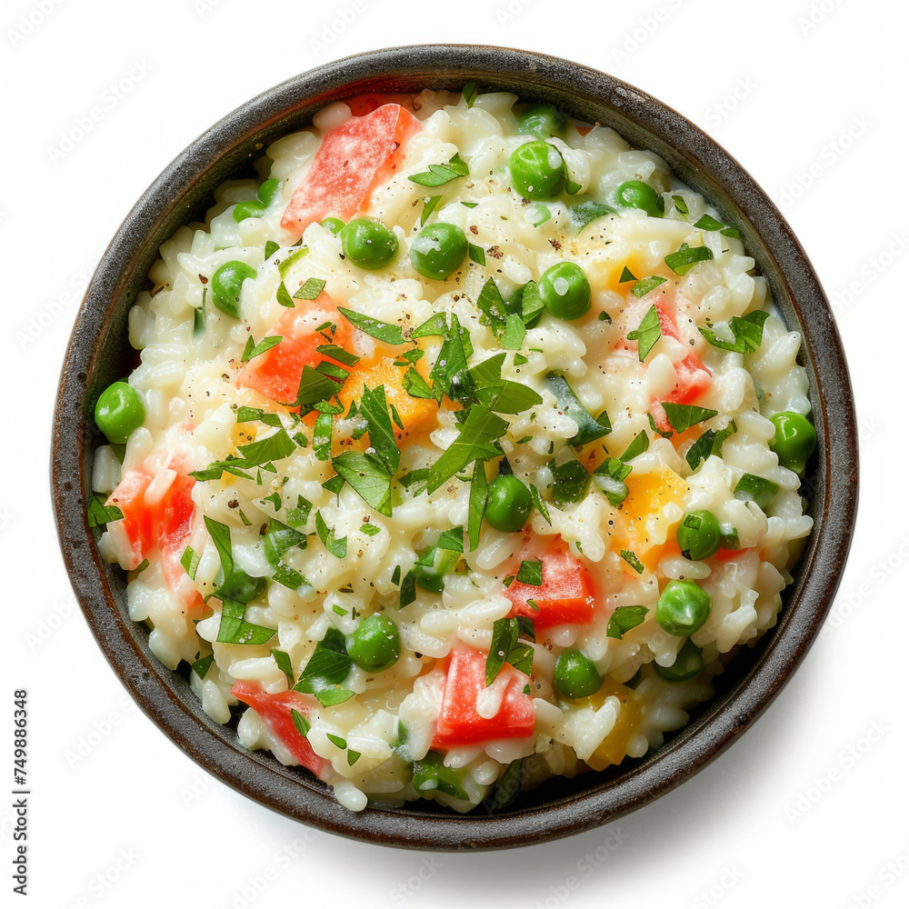 Spring vegetable risotto with peas, carrots, and fresh parsley in a dark bowl. Studio food photography for design and print. Top view.