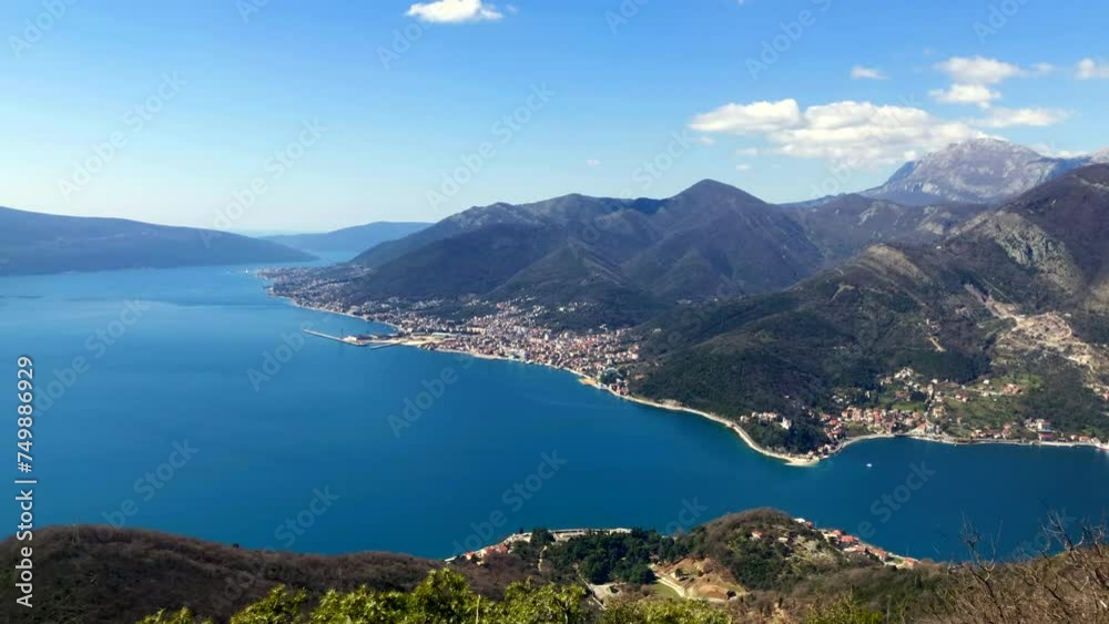 Aerial view of a seaside coastal towns on the Bay of Kotor. Ocean and mountain views. Adriatic Sea. Tivat, Montenegro. Europe. Aerial view of a seaside coastal towns on the Bay of Kotor. Ocean and mountain views. Adriatic Sea. Tivat, Montenegro. Europe.
