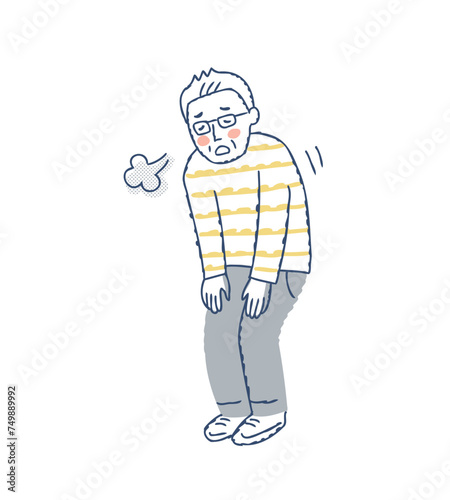 疲れてため息をついているシニア男性