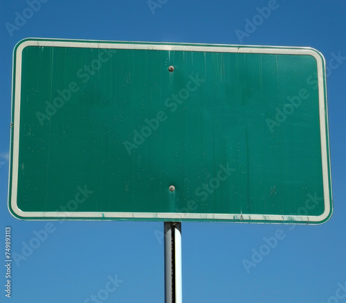 blank green sign with pole, blue sky