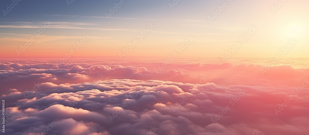 Aerial view of yellow sunset over white puffy clouds