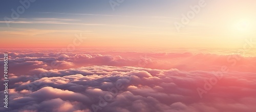 Aerial view of yellow sunset over white puffy clouds