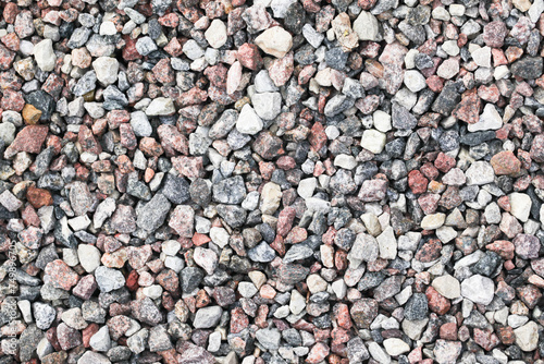 Gravel stones texture. Rocks backgroung. Gray noise backdrop. Pebble texture. Pile of rocks. Gravel made of crushed stone. Decorative backyard patio path.