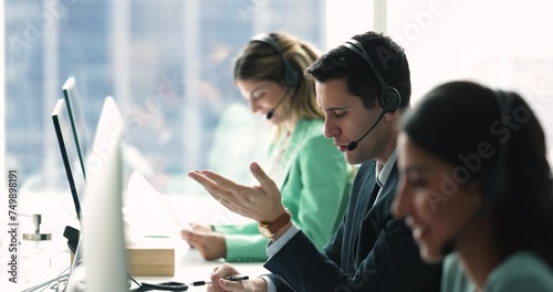 Workflow of call center employees, focus on young Hispanic man wear headset, provide customer service, support through call in callcenter office, consider inquiries, resolve issues of company clients photo