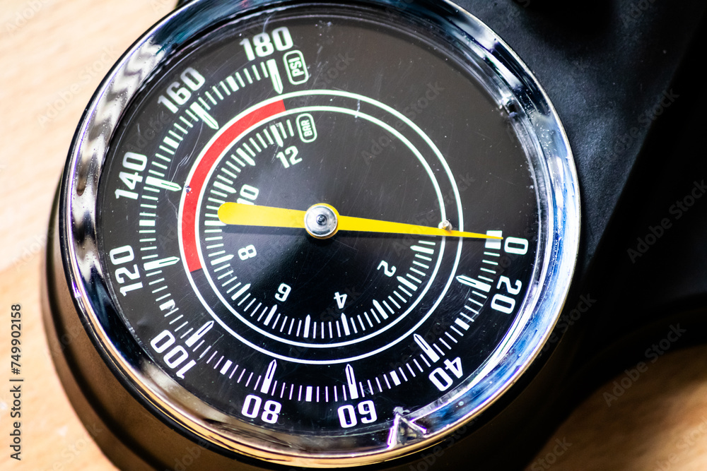 Bike air-pump with tachometer or pressure gauge shows tire pressure for manual tire inflation with manometer and pneumatic scala for bar and psi measure for bicycles and car tires to pump and inflate Bike air-pump with tachometer or pressure gauge shows tire pressure for manual tire inflation with manometer and pneumatic scala for bar and psi measure for bicycles and car tires to pump and inflate