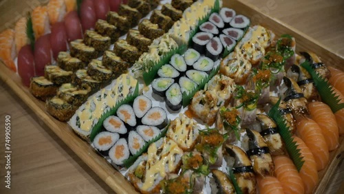Assorted Sushi Platter with a Variety of Rolls and Nigiri on a Wooden Tray