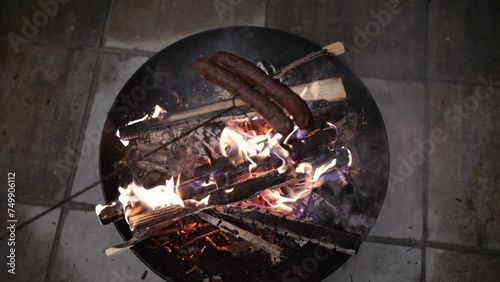 Open Fire Grilling of Sausages Over a Charcoal Fire Pit