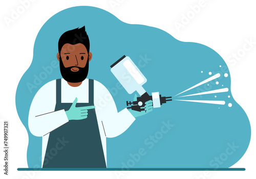A man in a special suit holds a paint spray gun.