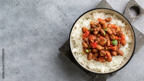 Vegan bean curry with rice and tomatoes. Indian cuisine. Vegetarian dish. 