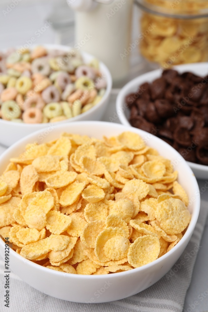 Different delicious breakfast cereals on table, closeup Different delicious breakfast cereals on table, closeup