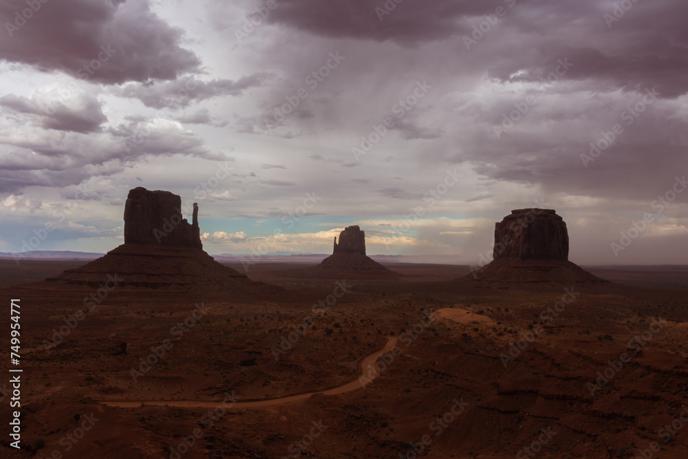 The Monument Valley Navajo Tribal Park in Arizona, USA. View of the West Mitten Butte, East Mitten Butte, and Merrick Butte Monuments.