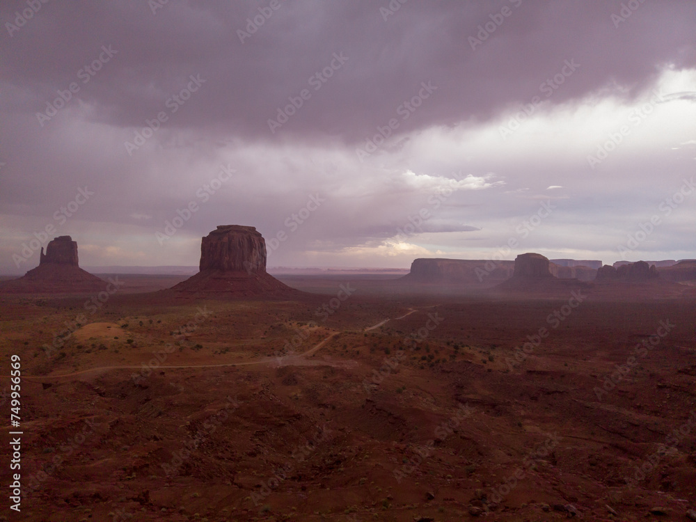 The Monument Valley Navajo Tribal Park in Arizona, USA. View of the East Mitten Butte, Merrick Butte, Elephant Butte, and the Artist's Point Monuments during a storm.
