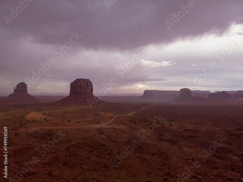 Obraz na płótnie The Monument Valley Navajo Tribal Park in Arizona, USA. View of the East Mitten Butte, Merrick Butte, Elephant Butte, and the Artist's Point Monuments during a storm. w salonie