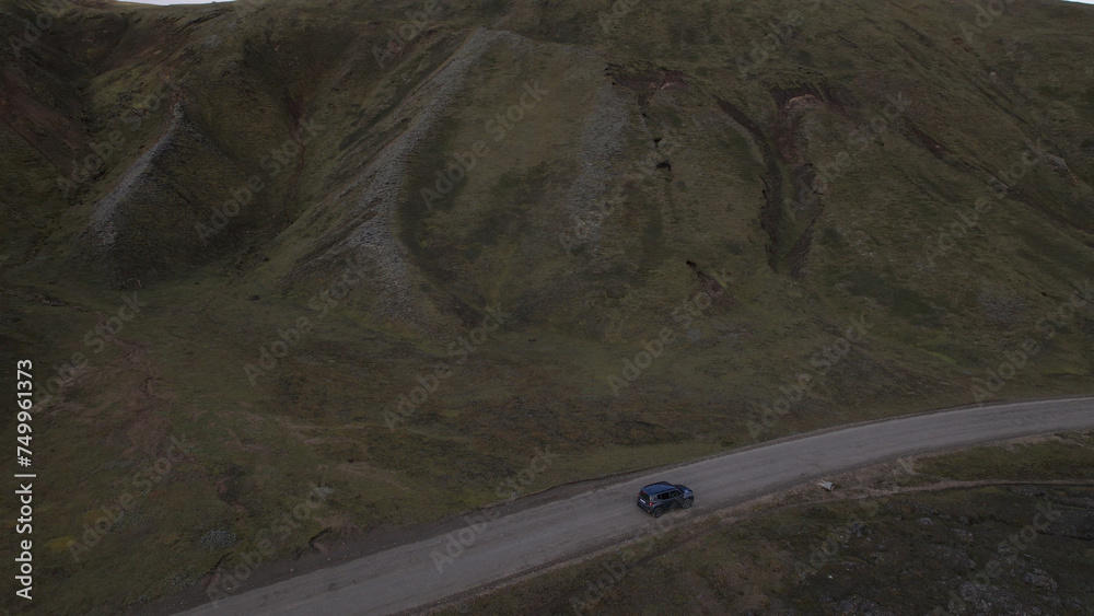 Car driving off-road terrain exploring the Fjallabak Natural Reserve. A 4x4 car driving dirt road traveling in Iceland sightseeing wilderness.