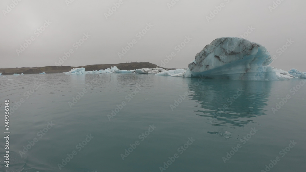 View from a boat of Jokulsarlon Glacier Lagoon in Iceland. Melting icebergs floating.