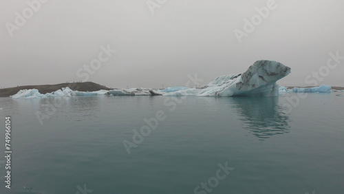 View from a boat of Jokulsarlon Glacier Lagoon in Iceland. Melting icebergs floating.