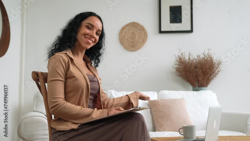 Psychologist woman in clinic office professional portrait with friendly smile feeling inviting for patient to visit the psychologist. The experienced and confident psychologist is crucial specialist photo