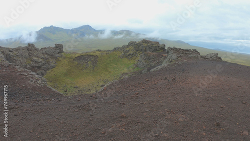 Obraz na płótnie Saxholl is a 45 meter high volcanic, oval-shaped crater. It rises up from the moss-covered lava fields in Snaefellsjokull National Park on the Snaefellsnes peninsula West Iceland. w salonie