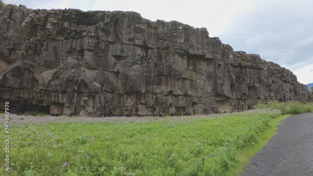 Almannagja is an eight-kilometer-long gorge within Pingvellir National Park, which marks the edge of the North American plate and the beginning of the Þingvellir rift valley in Iceland.
