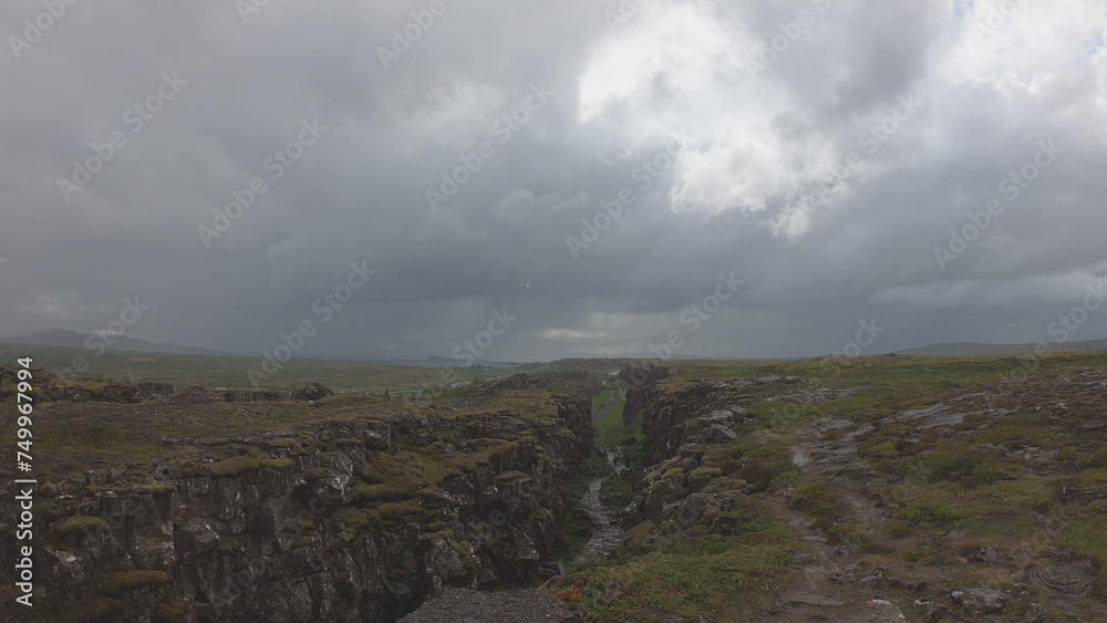Almannagja is an eight-kilometer-long gorge within Pingvellir National Park, which marks the edge of the North American plate and the beginning of the Þingvellir rift valley in Iceland.