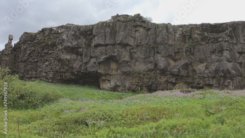 Obraz na płótnie Almannagja is an eight-kilometer-long gorge within Pingvellir National Park, which marks the edge of the North American plate and the beginning of the Þingvellir rift valley in Iceland. w salonie