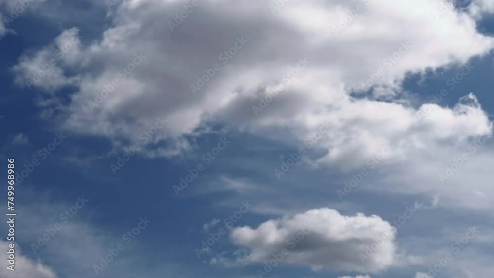 Roughly swelling white cumulus clouds flowing in the blue sky. Cloudscape time-lapse footage. Roughly swelling white cumulus clouds flowing in the blue sky. Cloudscape time-lapse footage.