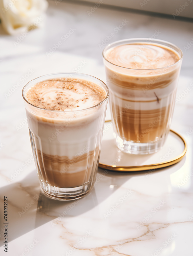 2 Glasses of Latte Macchiato, coffe on marble table 2 Glasses of Latte Macchiato, coffe on marble table
