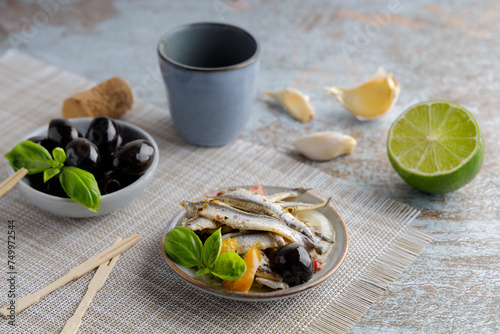 anchovy appetizer with olives.