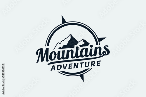 mountain adventure logo with a combination of mountain views, compass and beautiful lettering.