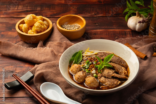 Thai Boat Noodle Soup, Thailand's most famous Rice Vermicelli noodle broth with pork blood (Kuaytiaw Reua) photo