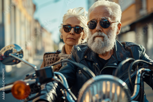 A senior couple enjoying life riding on a motorcycle together, active living  photo
