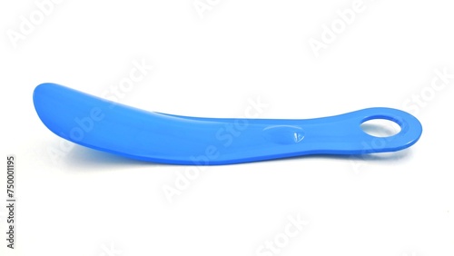 Photo of a blue plastic shoehorn, isolated on white background. photo