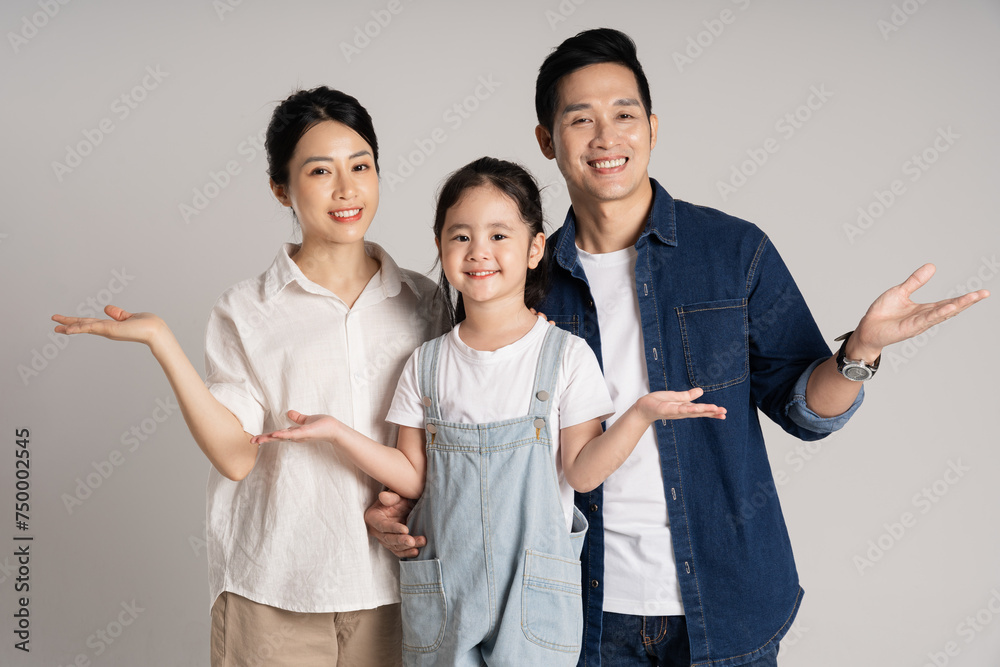Asian family portrait posing on white background Asian family portrait posing on white background