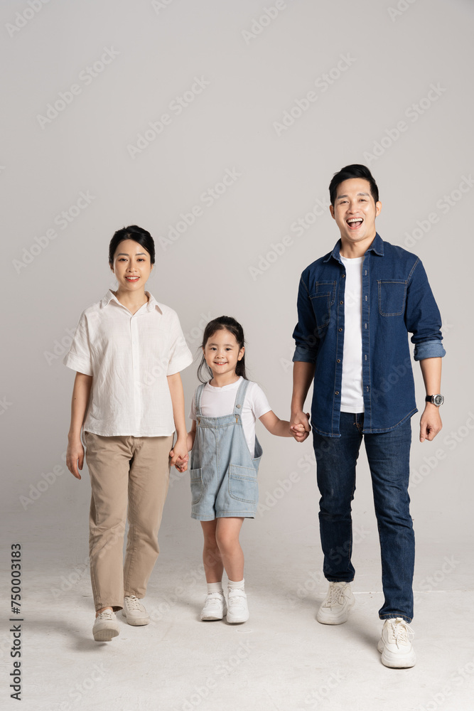 Asian family portrait posing on white background Asian family portrait posing on white background