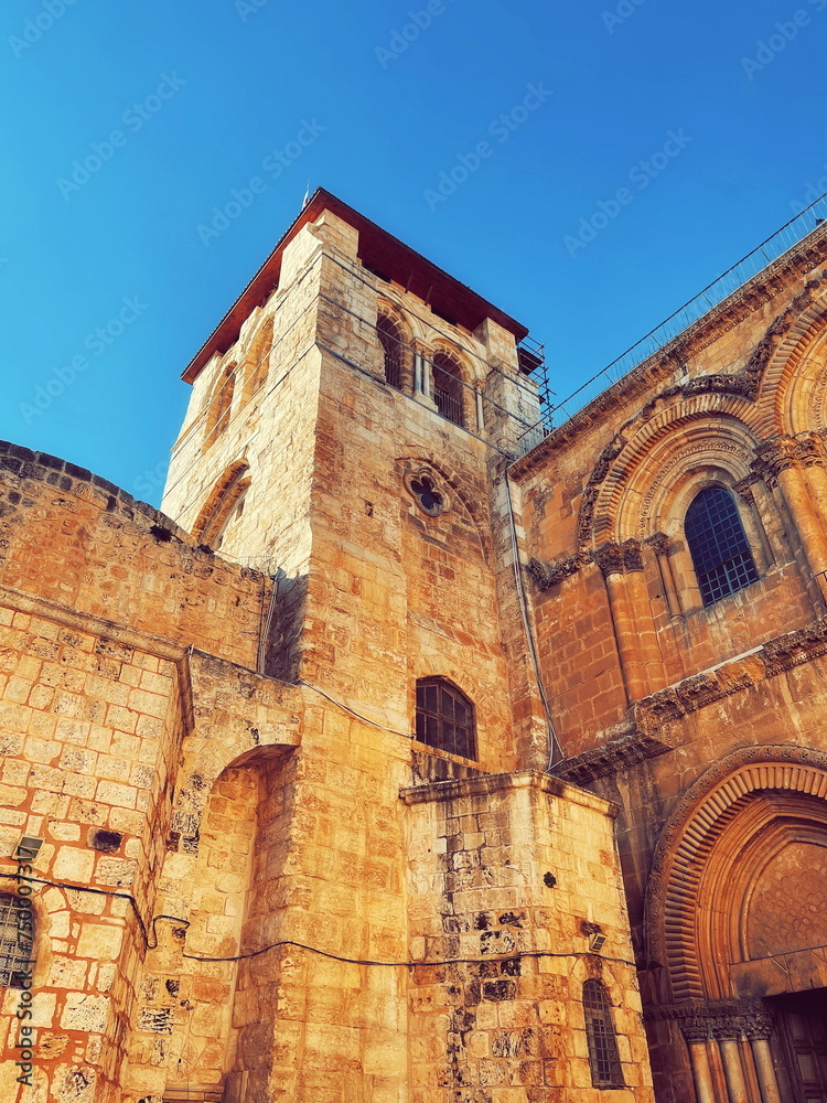 Radiant in History: An Ancient Stone Tower under a Clear Sky. The architectural elegance of a bygone era preserved in stone Radiant in History: An Ancient Stone Tower under a Clear Sky. The architectural elegance of a bygone era preserved in stone