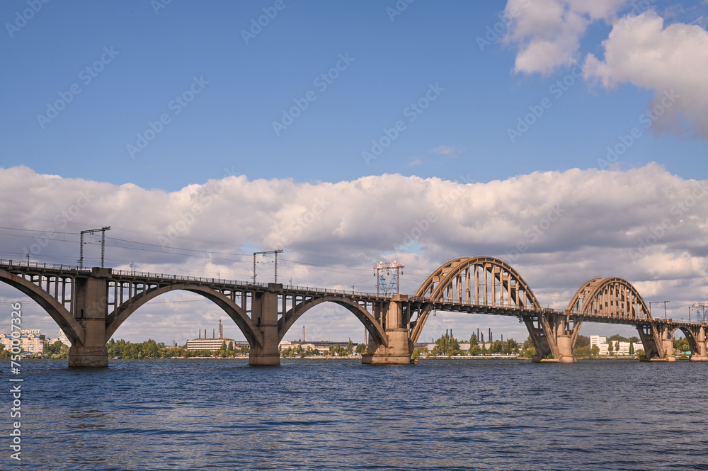 Fototapeta premium a road bridge over the Dnieper River in the city of Dnipro, Ukraine.