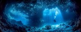 Bioluminescent caves beckon scuba divers their glow revealing the ancient secrets of reef ecosystems in the deep