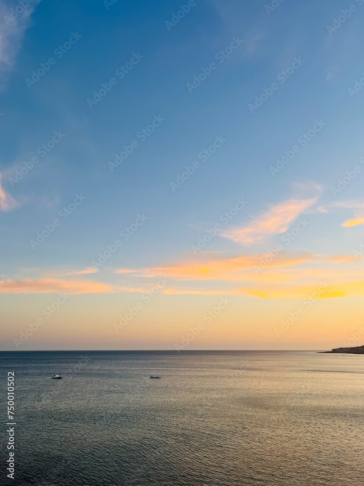 Orange sunset at the ocean, rocky ocean bay Orange sunset at the ocean, rocky ocean bay