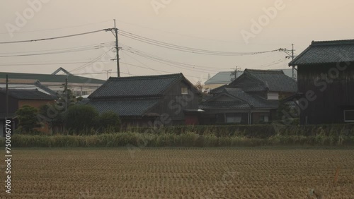 Rice fields and Traditional buildings in Fukuoka Prefecture, Japan photo