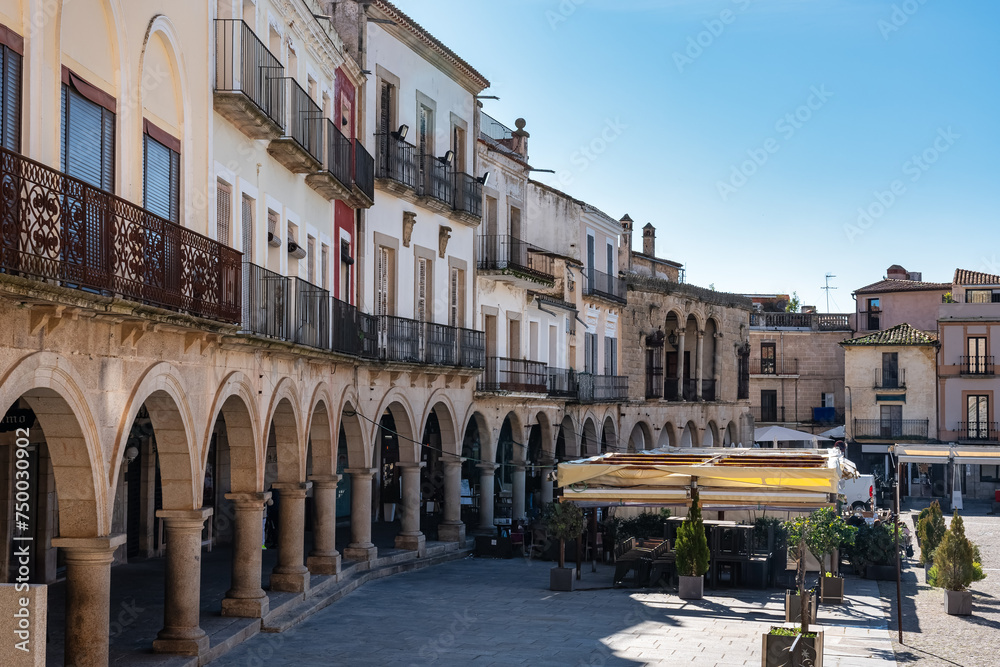 Old houses with stone arcades in the main square of the city of Trujillo, Spain.