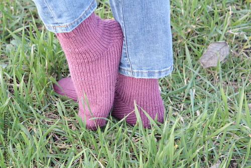 A person's feet in the grass