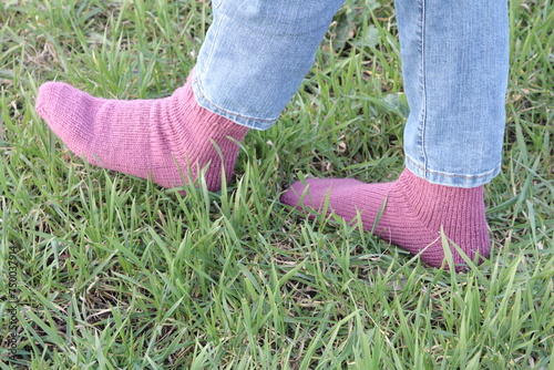 A person's feet in grass