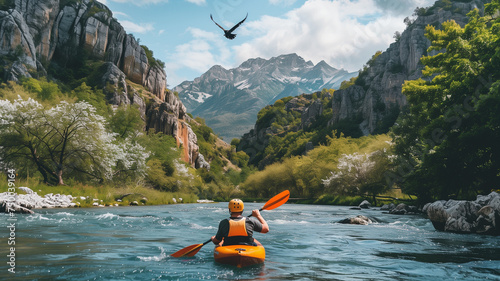 An athlete in a kayak rafting down a mountain river in beautiful nature © Maxim Sokolov