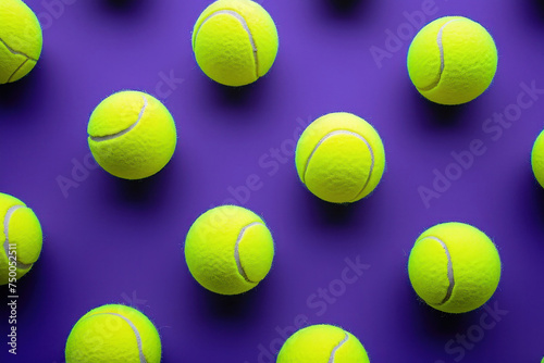 Pattern of tennis balls on purple surface with blue background © SHOTPRIME STUDIO