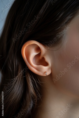 Macro image of a female ear, concept of healthy hearing or ear jewelry