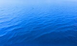  Abstract blue water background, blue colored clear calm water surface texture, blue water shining background, Shallow depth of field.