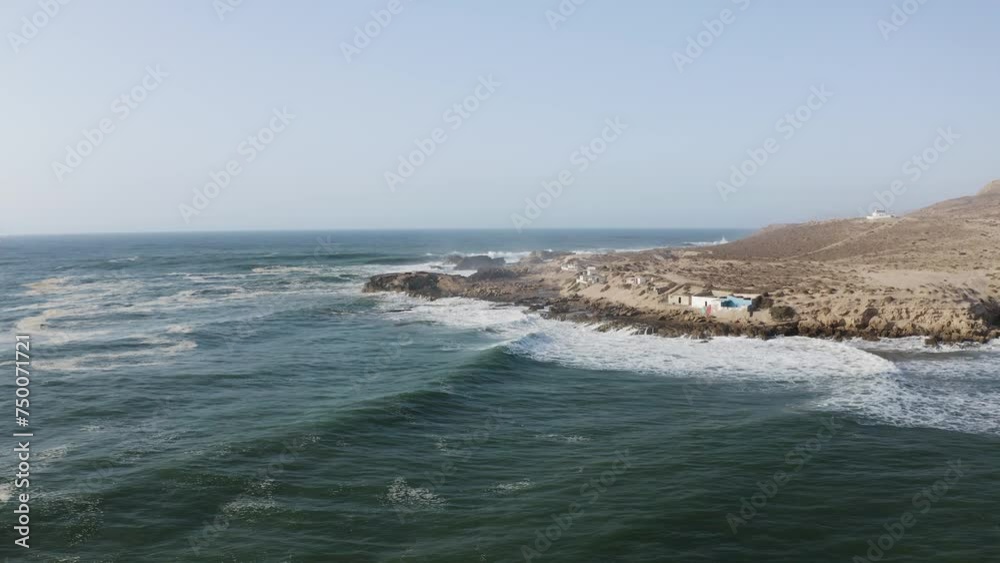 Aerial Drone View of the Ocean Waves Splashing and Breaking Waves of Atlantic Ocean Crashing to the Shore of Imsouane village of Morocco.
Aerial Drone View of the Ocean Waves Splashing and Breaking Waves of Atlantic Ocean Crashing to the Shore of Imsouane village of Morocco.